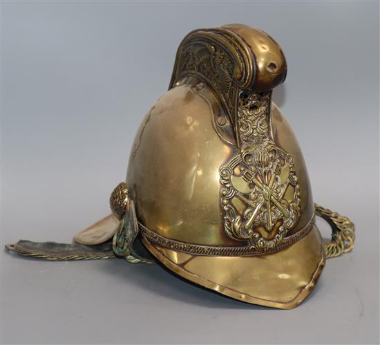 An early 20th century brass firemans helmet